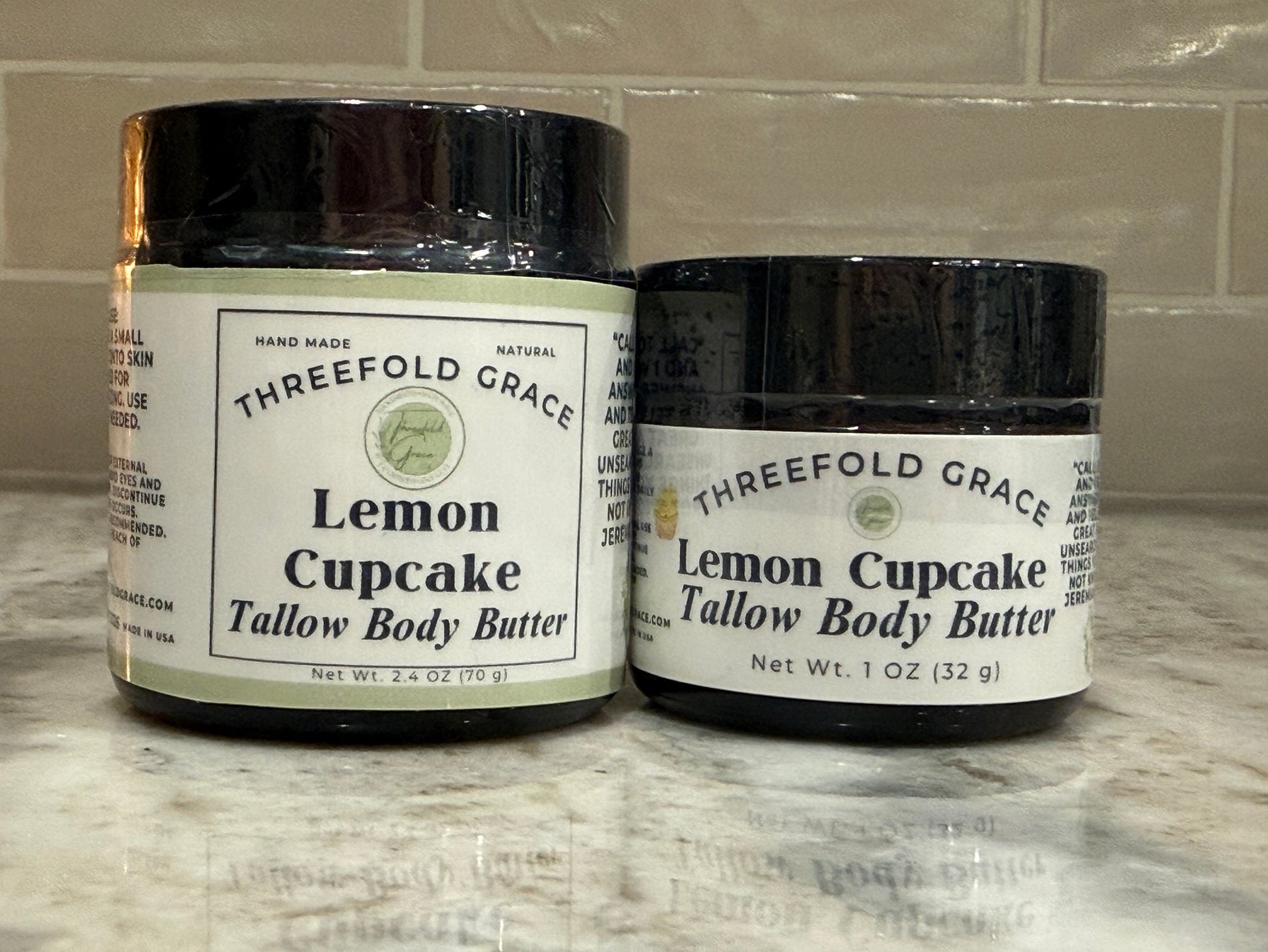 Two glass jars of Lemon Cupcake Tallow Body Butter with essential oils