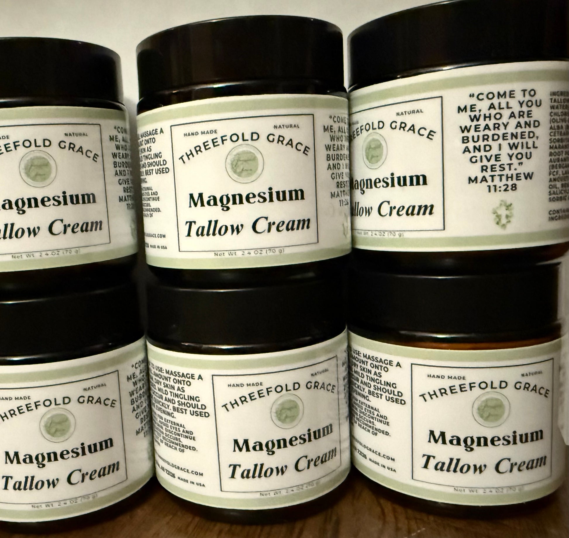 amber glass jars of magnesium tallow cream for legs and body 